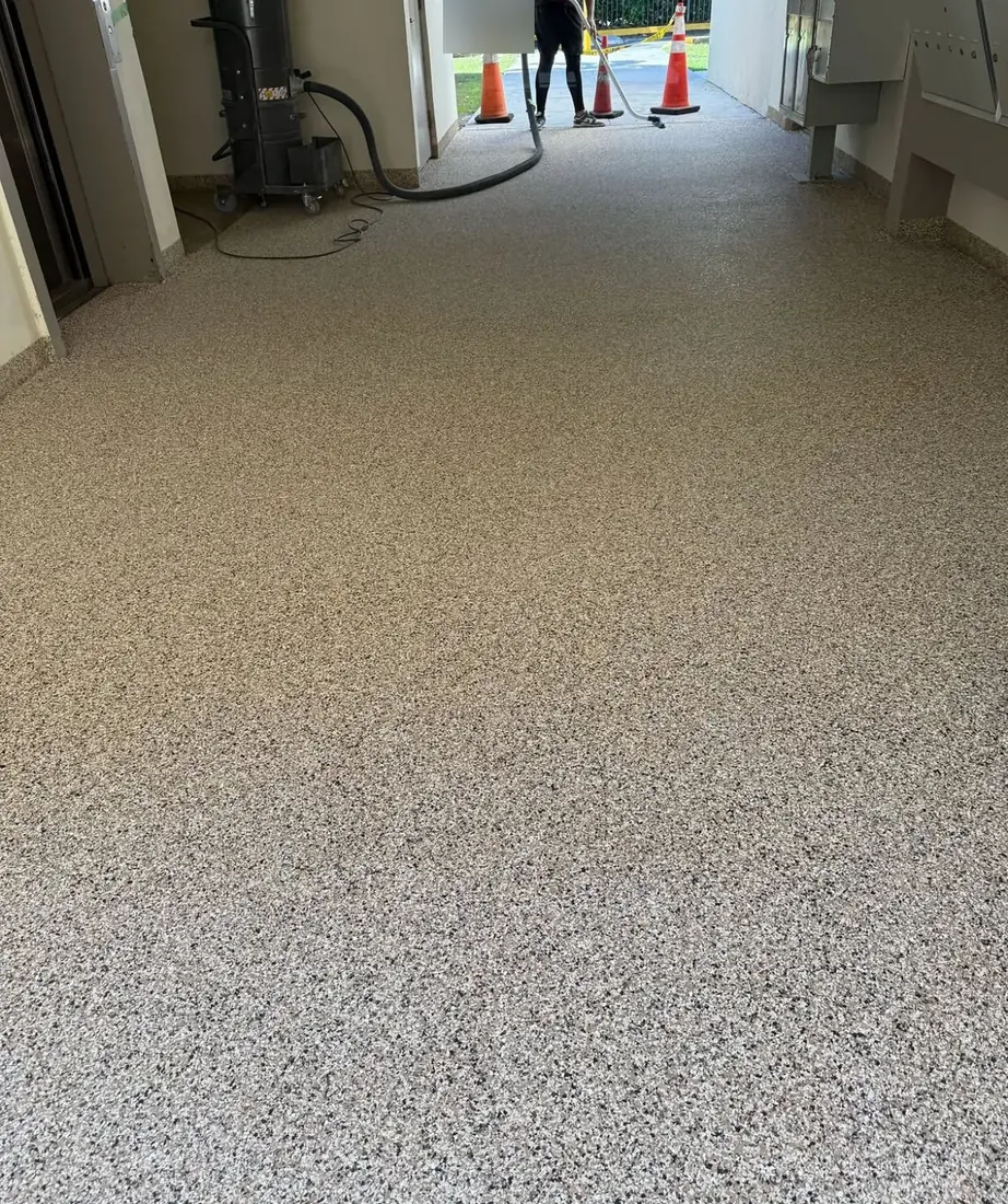 Lobby floor coating during final cleanup with an industrial vacuum